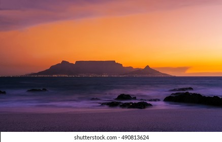 Table Mountain in Cape Town, South Africa at Sunset from Bloubergstrand Beach
