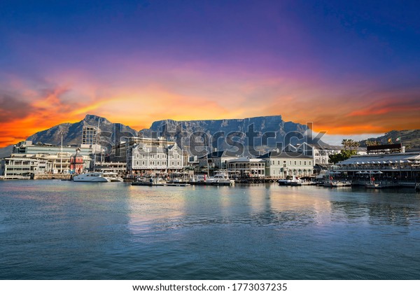 Table mountain waterfront boats and shops in Cape\
Town South Africa