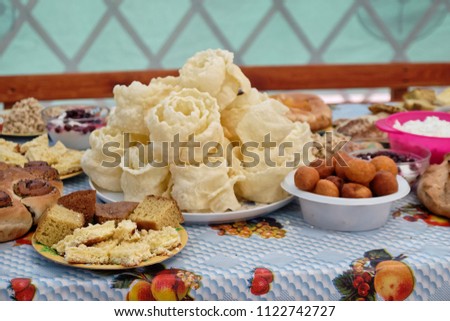 Table with national dishes. Brushwood. Muslim holiday