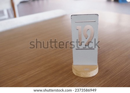 table number in cafe, as marker, table number, table number in the restaurant, number 19, as a sign that the place has been booked and made a reservation, nomor meja, nomor meja di cafe dan retoran