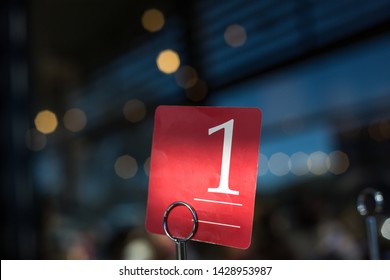 Table Number One Sign On A Cafe Restaurant Table With A Sprinkling Light Dark Background