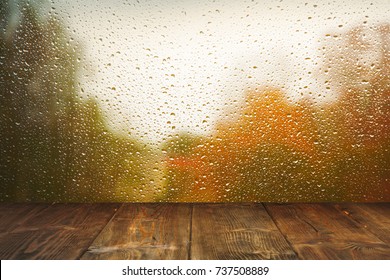 Table On Rainy Window Background