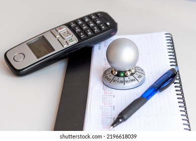 Table With Organizer, Phone And Wheel Of Opportunity, Pointer On GET A JOB, Accidental Luck Concept