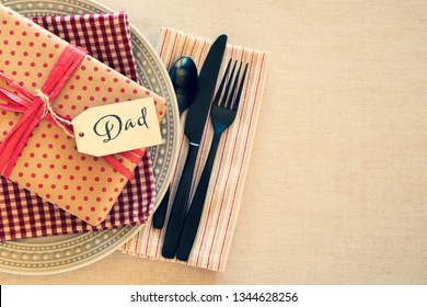 Table Place Setting For Dad For A Birthday Party Or Father's Day Celebration Dinner And Background Room Or Space For Copy, Text Or Words.  Horizontal With Cross Process Tint And Flat Layout