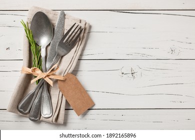Table place setting. Vintage tableware on wooden background.