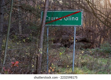 Table - a road sign meaning the end of the forest village. The middle of the forest in the peak of autumn on the periphery of a forest village " Czarna Glina " ("Black Clay").  - Shutterstock ID 2232598175