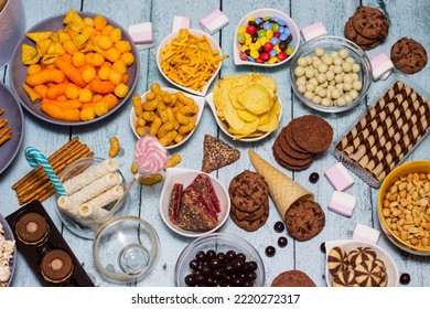 Table Of Salty And Sweet Snacks. Large Group Of Unhealthy Food