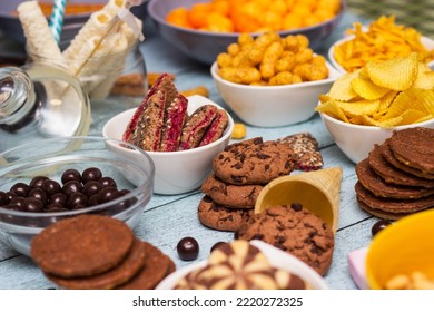 Table Of Salty And Sweet Snacks. Large Group Of Unhealthy Food