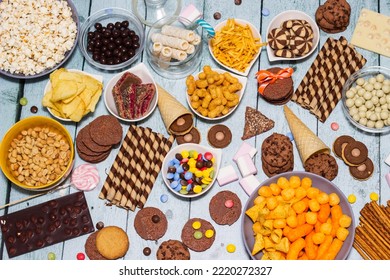 Table Of Salty And Sweet Snacks. Large Group Of Unhealthy Food