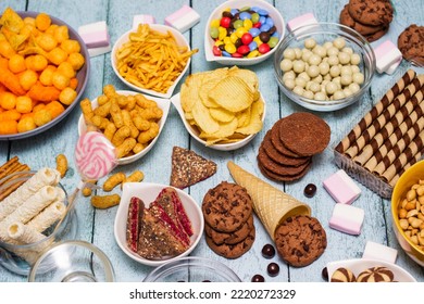 Table Of Salty And Sweet Snacks. Large Group Of Unhealthy Food