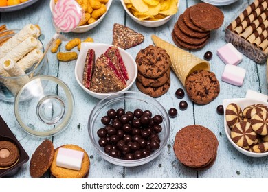 Table Of Salty And Sweet Snacks. Large Group Of Unhealthy Food