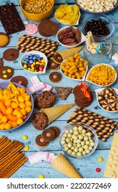 Table Of Salty And Sweet Snacks. Large Group Of Unhealthy Food