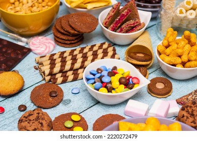 Table Of Salty And Sweet Snacks. Large Group Of Unhealthy Food