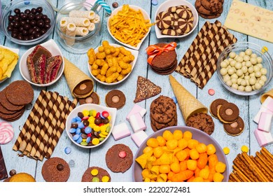 Table Of Salty And Sweet Snacks. Large Group Of Unhealthy Food