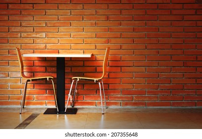 table set against brick wall