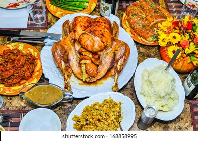 Table Set Up Before Thanksgiving Dinner With Turkey, Gravy, Stuffing