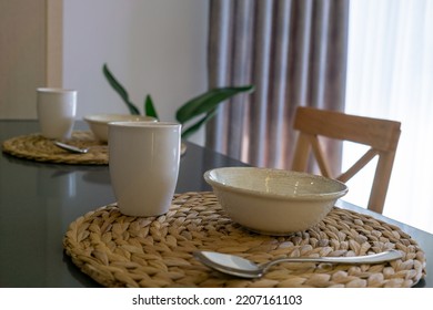 Table Set For Breakfast For Two People With Cutlery Set In A Lighted Space