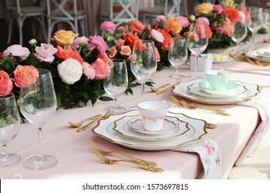 table set up for bridal shower, vintage tea set and floral napkins