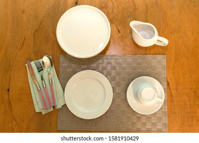 Table set with crockery and kitchen elements