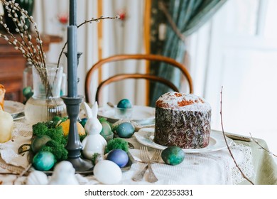 Table Set For Easter On Veranda On Sunny Spring Day Decorated With Flowers And Easter Decor, Eggs, Cake And Willow Branches, Easter Family Celebration, Grain And Noisy Effect