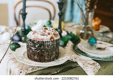 Table Set For Easter On Veranda On Sunny Spring Day Decorated With Flowers And Easter Decor, Eggs, Cake And Willow Branches, Easter Family Celebration, Grain And Noisy Effect