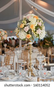 Table Set For An Event Party Or Wedding Reception, Focus On Centerpiece Bouquet