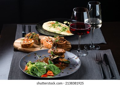 Table Set Italian Dinner In The Restaurant. Top View Of Various Italian Dishes With Red And White Wine