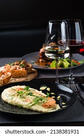 Table Set Italian Dinner In The Restaurant. Top View Of Various Italian Dishes With Red And White Wine