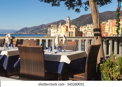 Table Set In Italian Restaurant In Front Of Camogli Bay, Near Genoa