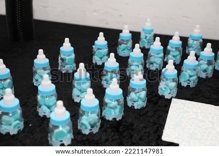 A table set in light blue colors at the circumcision event brit mila for a Jewish baby