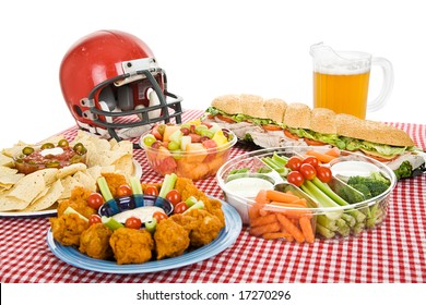 Table Set With Munchies For A Super Bowl Party.  White Background.