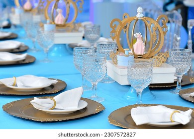 table set for a party, tables decorated with cinderella's carriages, themed party decor cinderella party