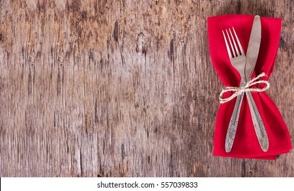 Table set with red napkin. Fork, knife, napkin. Top view, copy space.  Serving, Table decoration Valentine's Day - Powered by Shutterstock