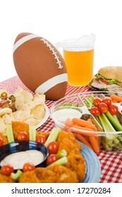 Table Set With Snack Foods For A Super Bowl Party.  (focus On Football) Vertical View With White Background.