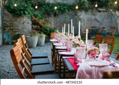 Table set for wedding or another catered event dinner in pink color