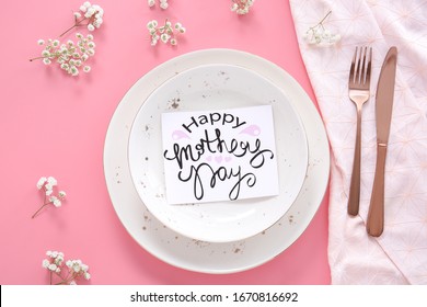 Table Setting With Card For Mother's Day Dinner On Color Background