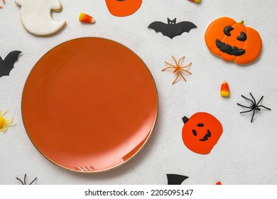 Table Setting With Cute Halloween Decor On White Background