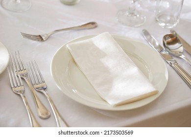  table setting with cutlery and napkin - Shutterstock ID 2173503569
