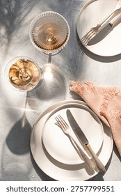 Table setting elegant and  romantic. Two plates, and glasses, linen napkins.