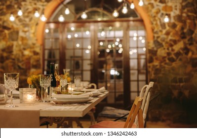 Table Setting With Empty Chairs For Party. Table Ready For Dinner Party Outdoors In Evening.