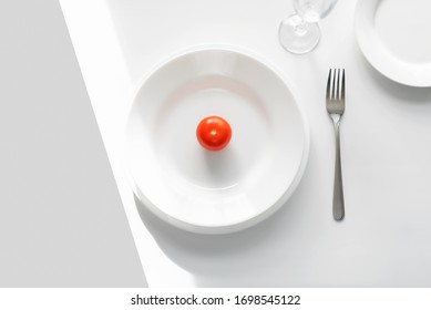 Table Setting Example. White Plates On A White Background In The Light Of The Sun. Tomato On A Plate. Place For Text