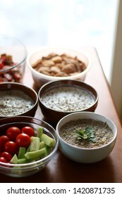 Table setting with galette, snacks, dips and salads. Selective focus.