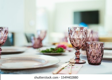 Table Setting With Glasses Of Water On Table	