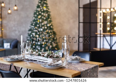 Table setting with holiday decorations. Preparation for christmas dinner