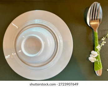 The table setting includes plates, soup bowls, and cutlery.