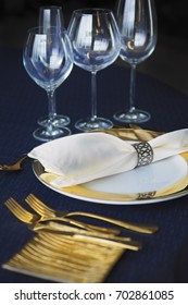 Table Setting Luxury Set Dish,knife,sppon And Fork,wineglass On Blue Tablecloth