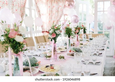 Table setting at a luxury wedding and Beautiful flowers on the table. candles, moss