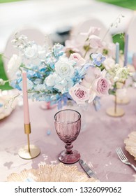 Table setting at a luxury wedding reception. Outdoor wedding