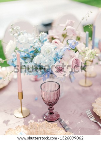 Table setting at a luxury wedding reception. Outdoor wedding