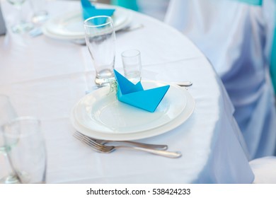 Table Setting. A Paper Boat.